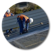A Red Diamond Roofing crew working on the roof of a commercial building in Denver.