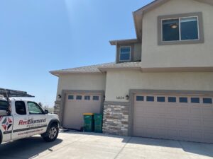 Red Diamond truck in front of home roofing project